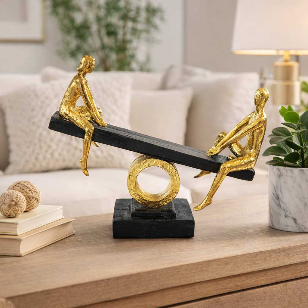 Abstract Figures on Seesaw Sculpture | Gold and Black Fiber Art