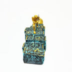 Golden Figurine Pulling Ball on Stairs