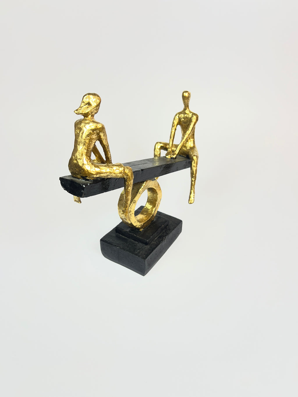 Abstract Figures on Seesaw Sculpture | Gold and Black Fiber Art